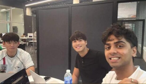 Founders working on their laptops in a co-working space